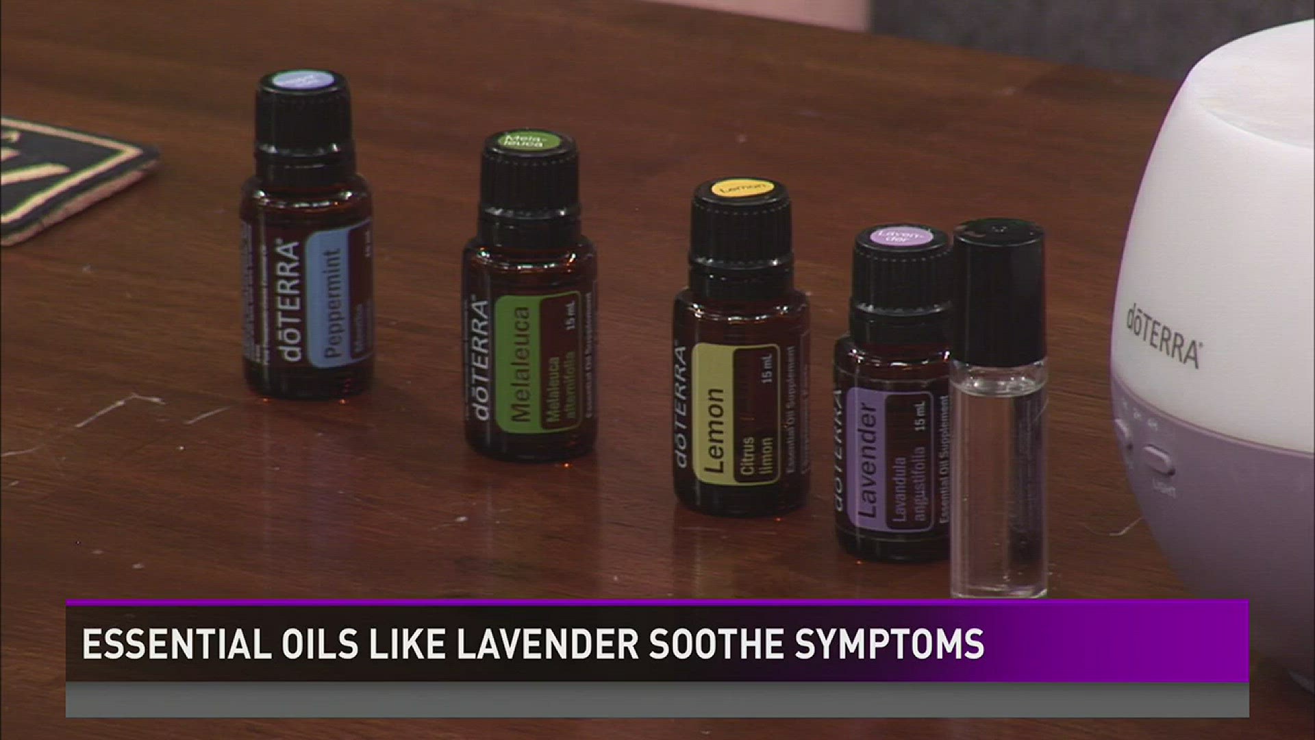 Bottles of doTERRA essential oils: Peppermint, Melaleuca, Lemon, Lavender with a diffuser